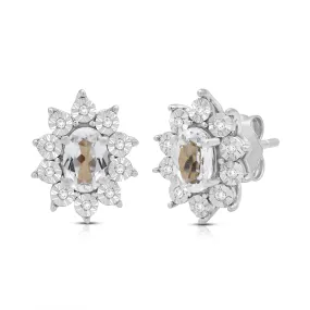 Jewelili Sterling Sliver 6x4 MM Oval Created White Sapphire and 1/20 Cttw Natural White Round Diamond Cluster Stud Earrings