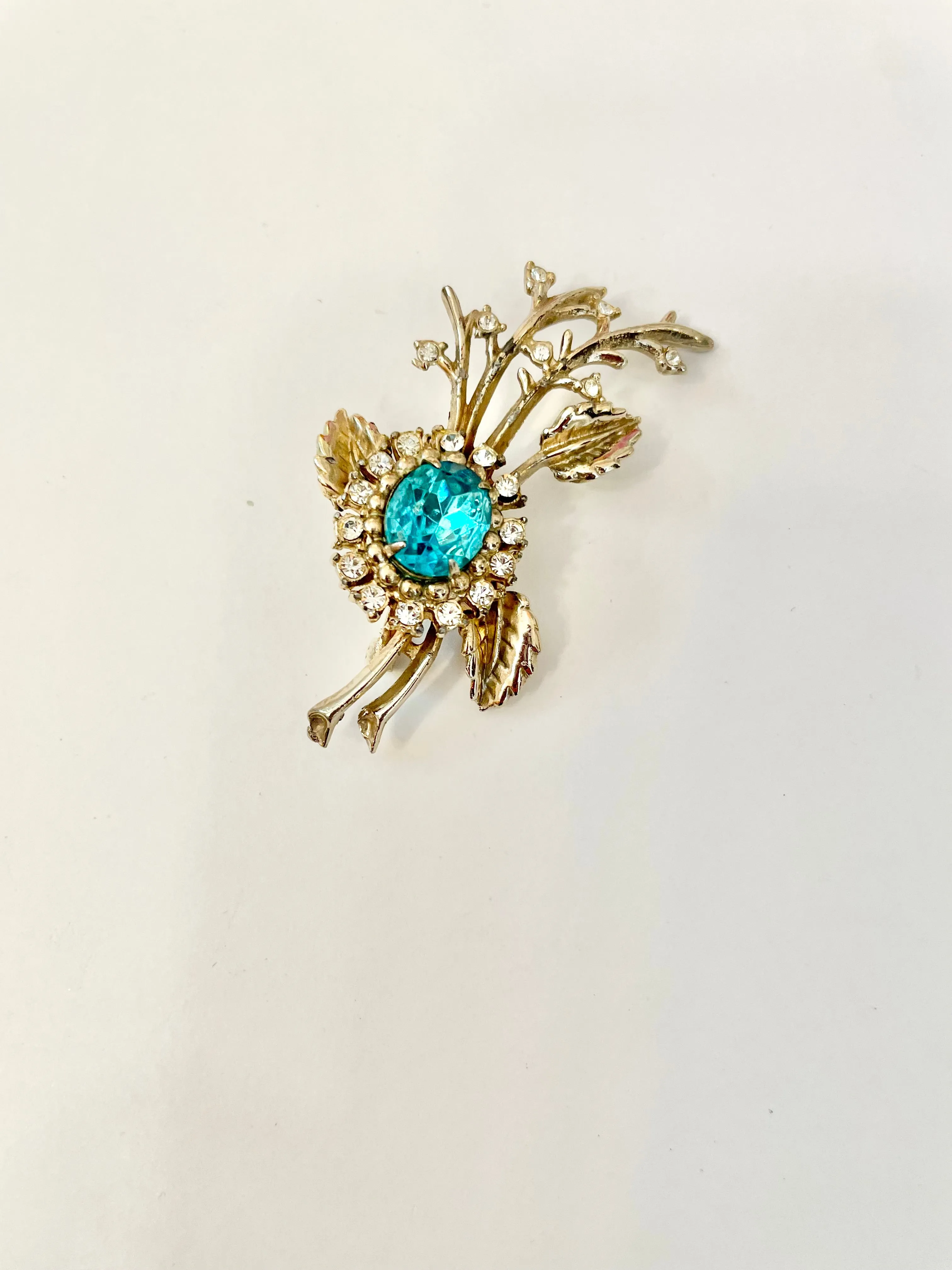 The happy hostess loves a colorful brooch... oh so divine!