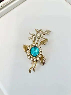 The happy hostess loves a colorful brooch... oh so divine!